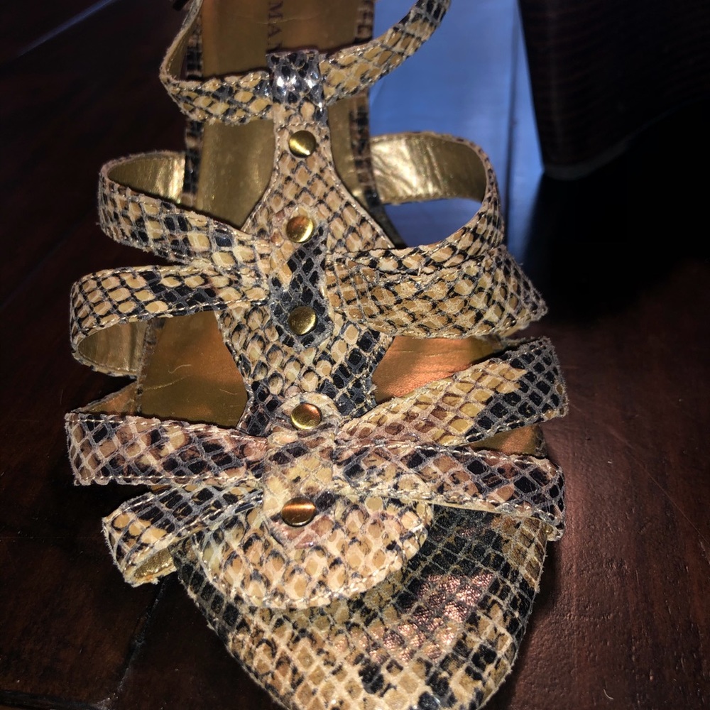 Gladiator caged wedge snake embossed sandals.
